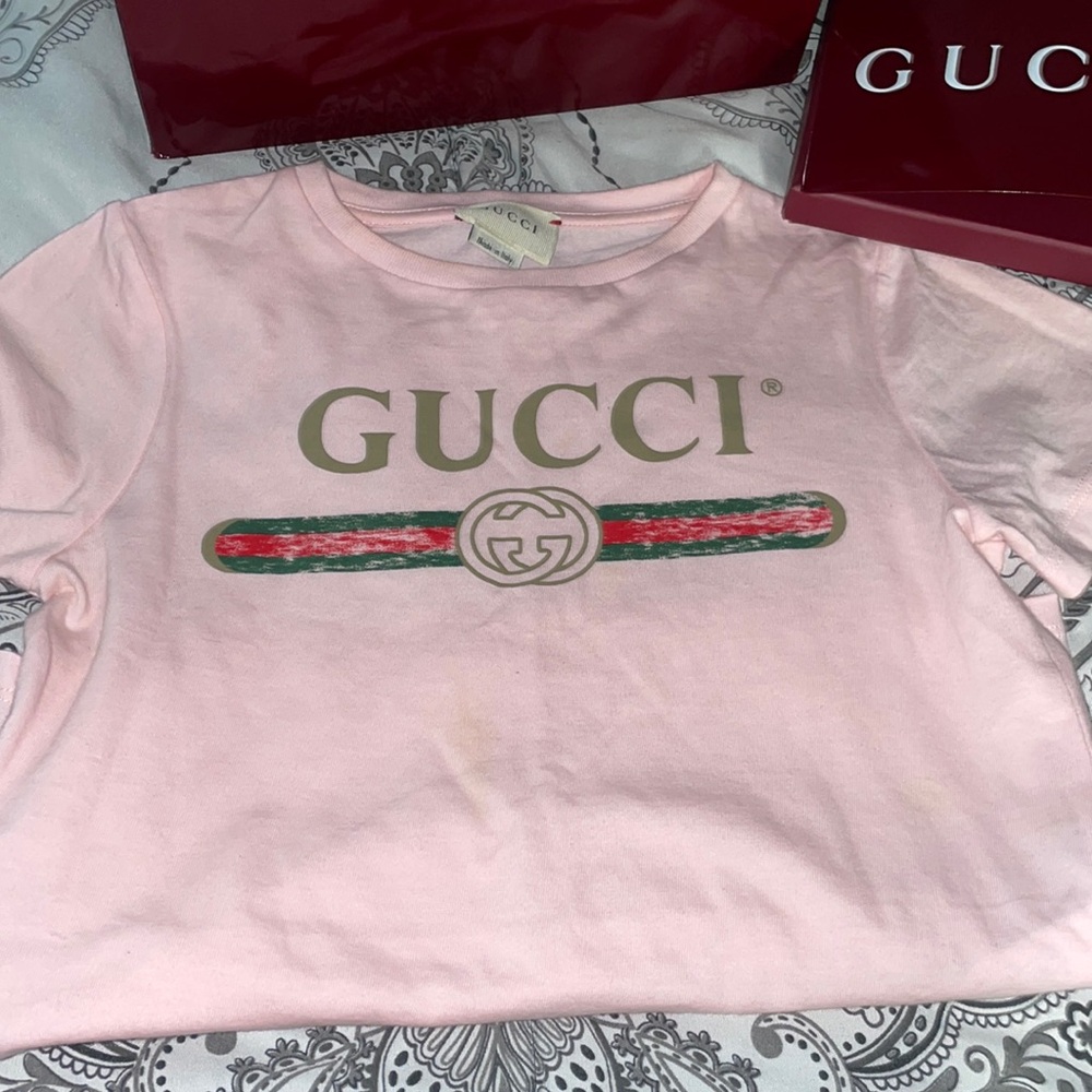 Pink kids gucci shirt.